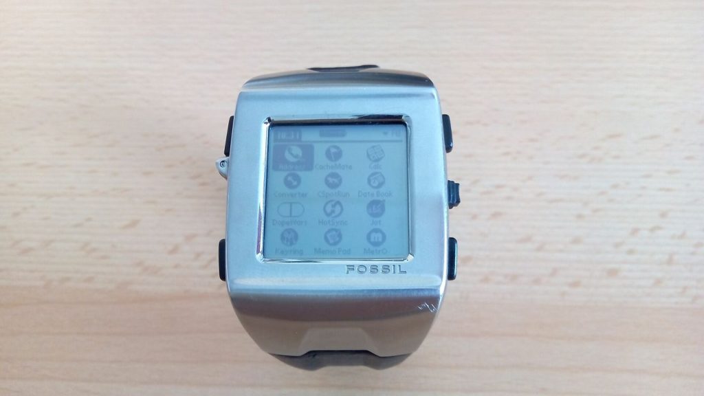 A smartwatch on a wrist showing its watch face